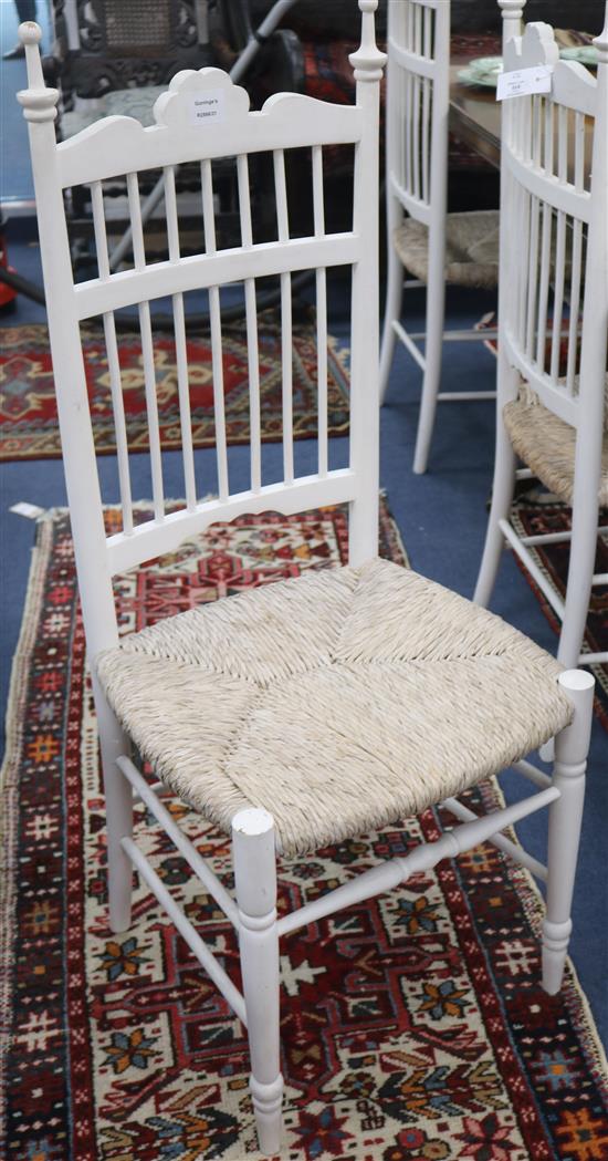 A set of six white rush seat dining chairs